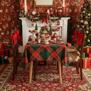 Rectangular red and green plaid Christmas tablecloth with decorative fringe details
