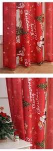 Detail of red Christmas curtain fabric showing festive Santa Claus and snowflakes print