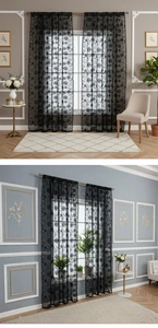 Detailed view of black lace curtains featuring exquisite floral embroidery and wavy edges