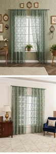 Close-up of green lace curtains featuring vintage Damascus floral patterns and scalloped edges