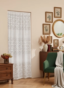 Close-up of white French lace door curtain with vintage patterns for home decor