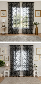 Detail view of black French lace curtain with delicate floral patterns and scalloped edges