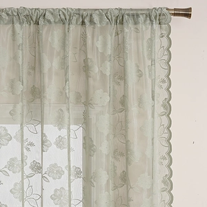 Sage green French lace curtains with floral embroidery and scalloped wave edges