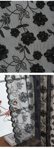 Detailed macro view of black vintage floral lace embroidery with wave edge patterns