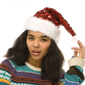 Close-up of a festive red sequin Christmas hat with plush white trim and a white pompom