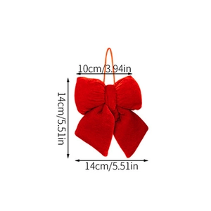 Detailed macro view of 14cm red velvet Christmas bow with hanging string and soft texture