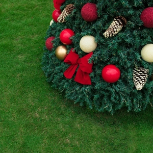 Christmas tree decoration set with red velvet bow, festive gold balls and natural pinecones