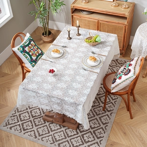 Elegant white floral lace tablecloth with scalloped edges for rectangular dining tables