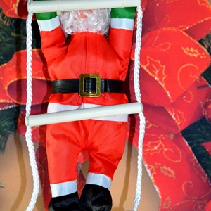 Detail of 25cm climbing Santa Claus ornament with white ladder and red festive clothes