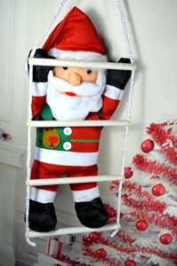 Detail of Santa Claus figure with reindeer motifs climbing a white rope ladder decor