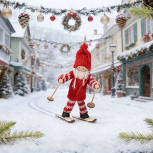 Detail of wooden skiing gnome doll with red striped knitting and white beard decor