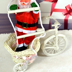 Detail of Santa Claus riding a white tricycle with woven basket on plush holiday background