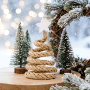 Detail of Nordic wooden Christmas tree ornament with rope texture and star top