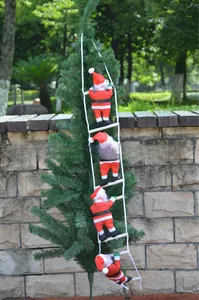 Detail of four Santa Claus figures climbing a white rope ladder on a green Xmas tree