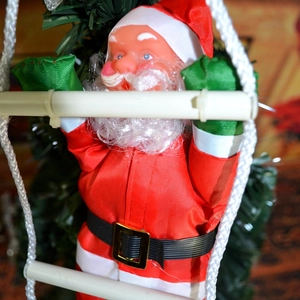 Close-up of 25cm Santa Claus figurine climbing a rope ladder for Christmas tree decor