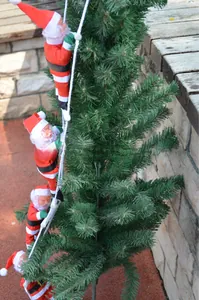 Detail of four Santa Claus figures climbing a white rope ladder on a Christmas tree decor