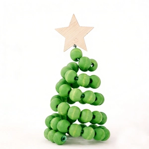 Macro detail of a spiral Nordic wooden bead Christmas tree with a natural star topper
