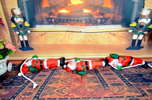 Three Christmas Santas on white rope hanging ornament for indoor festive decoration