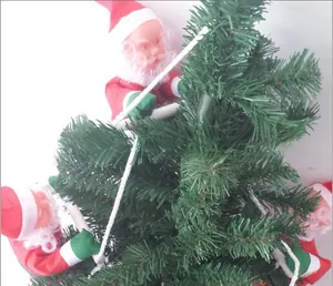 Detailed view of several mini Santa Claus figures climbing on green Christmas tree branches
