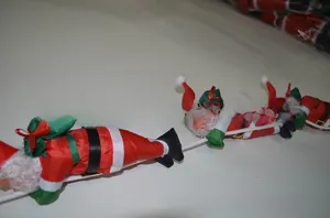 Close-up of 25cm climbing Santa Claus dolls on rope for Christmas tree decoration