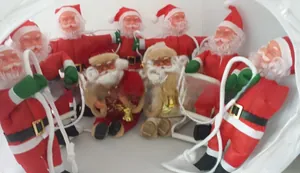 Detail of Santa Claus figures climbing a rope ladder for Christmas tree decoration
