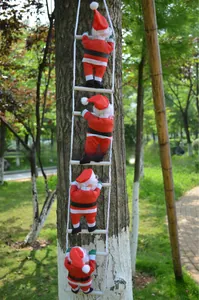 Outdoor festive scene showing four Santa Claus figures climbing a white rope ladder