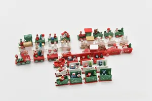 Detail of wooden Christmas train toy with hand-painted Santa and snowman figures