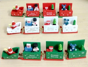 Detail of wooden 7-section Christmas train with Santa and snowman figurines