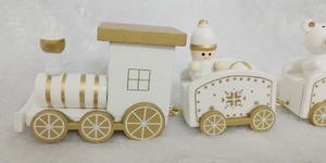 Detailed side view of a white and gold wooden Christmas train with polar bear and snowman