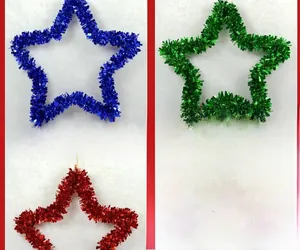 Three-color star-shaped tinsel garlands in blue, green and red for festive wall hanging
