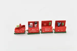 Detail of red wooden 7-section Christmas train with Santa and snowman figures
