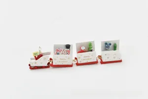 Detailed view of wooden Christmas train with Merry Christmas text and miniature figures