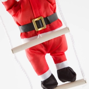 Climbing Santa Claus on rope ladder for Christmas tree and festive home decoration