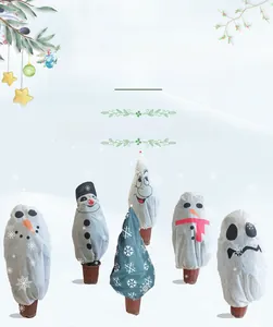 Winter non-woven plant covers with snowman and ghost patterns for garden frost protection