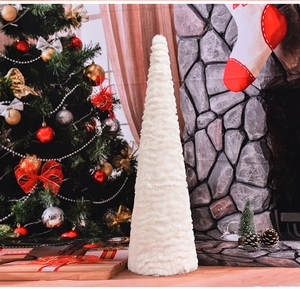 Detailed view of white faux fur cone Christmas tree with soft plush texture for home decor
