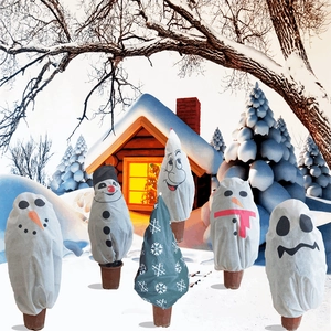 Detail of Christmas plant frost protection covers featuring snowman and snowflake patterns