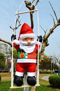 Detail of hanging 60cm climbing Santa Claus ornament on a rope ladder with wooden pedals