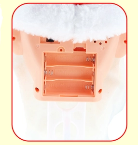Close-up of the battery compartment and ON/OFF switch on the electric Santa toy