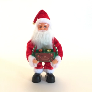 Classic musical Santa Claus figurine holding a Merry Christmas gift box on white background