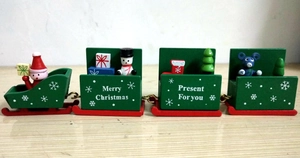 Detail of wooden 7-section Christmas train set with Santa Claus and festive figurines