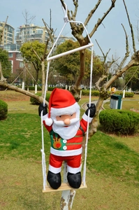 Detail view of Santa Claus swing hanging ornament with reindeer pattern and rope
