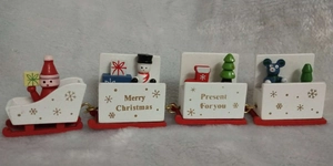 Detailed view of a 4-section wooden Christmas train with Santa and snowman figurines