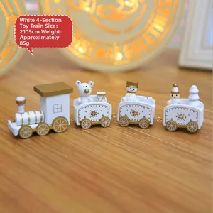 Detailed view of a white and gold wooden Christmas train ornament, size 21x5cm
