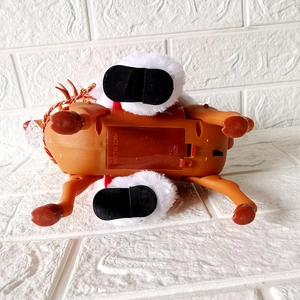 Musical Santa riding reindeer electric toy with battery compartment and power switch view