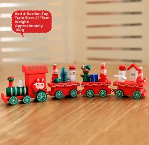 Detail view of red wooden Christmas train decoration measuring 21x5cm on table