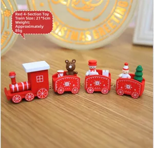Detail of red wooden 7-section Christmas train set with mini snowmen and gift boxes