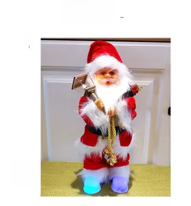 Detailed view of musical Santa doll with glowing base and miniature oil lamp decor