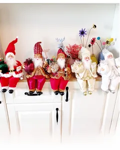 Detailed set of five sitting Santa Claus figurines in velvet with festive accessories