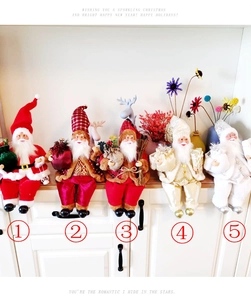 Set of five plush sitting Santa Claus figurines in various festive fabric outfits