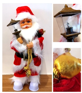 Detail of 30cm electric Santa Claus doll holding a vintage lantern and golden gift bag